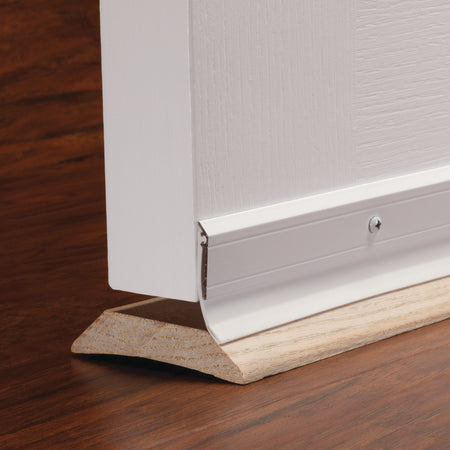36 in. White Aluminum and Vinyl DENY™ Heavy-duty Screw-on Door Sweep In Use