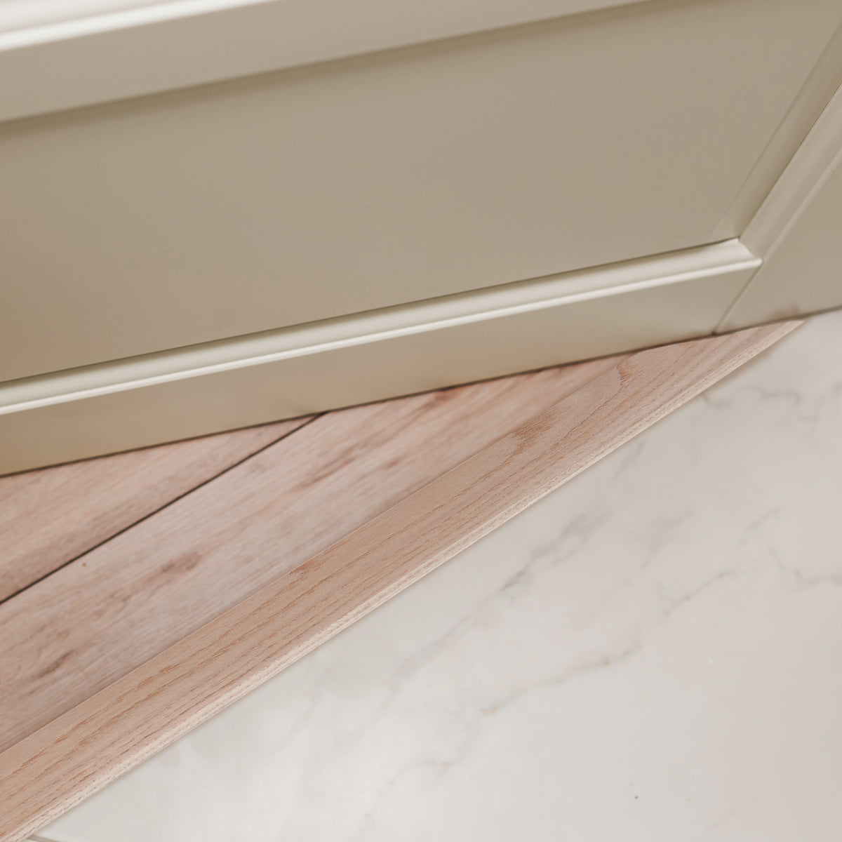 36 in. Natural Hardwood Flat-Profile Threshold for Doorways 3 in. x 3/8 in. In Use