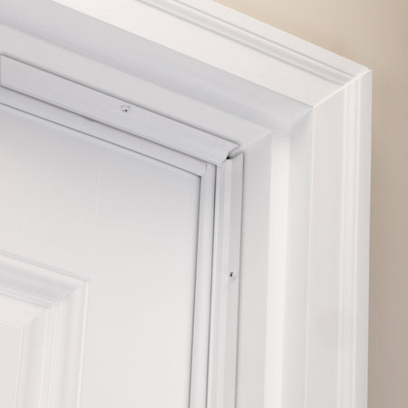 White Aluminum and Vinyl-coated Foam Heavy-duty Screw-on Top and Sides Door Seal Kit In Use